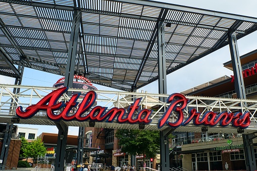 Atlanta, GA, USA: June 12,2021-An entrance to Truist Stadium in  Atlanta, Georgia. The stadium is a ballpark and the home field of Major League Baseball team of Atlanta Braves and is located in a multi use complex The Battery with many shops and restaurants.