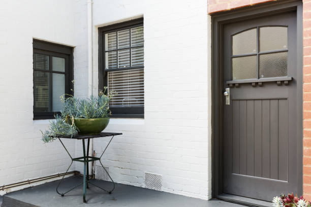 Entry porch and front door of an art deco style apartment stock photo
