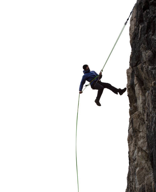 Epic Adventurous Extreme Sport Composite of Rock Climbing Man Rappelling stock photo