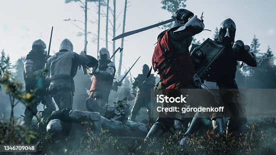 istock Epic Armies of Medieval Knights on Battlefield Clash, Plate Body Armored Warriors Fighting Swords in Battle. Bloody War and Savage Conquest. Historical Reenactment. Cinematic Shot 1346709048