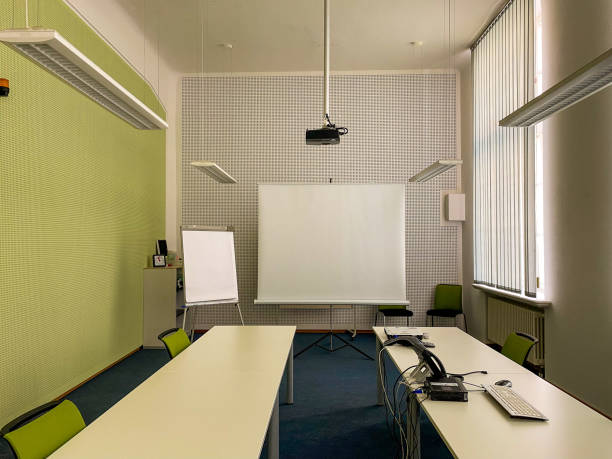 Equipment of a conference room with projector, board, flipchart, computer and telephone stock photo