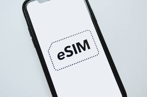 eSIM card chip logo on the smartphone screen. stock photo
