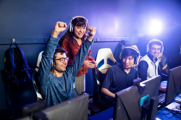 Esports Team with Coach Giving Advice stock photo