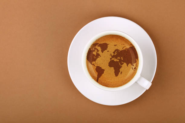 Espresso coffee cup with world map on table stock photo