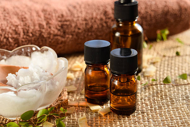essential oils and coconut oil for beauty treatment stock photo