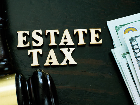 Estate tax from wooden letters and gavel.