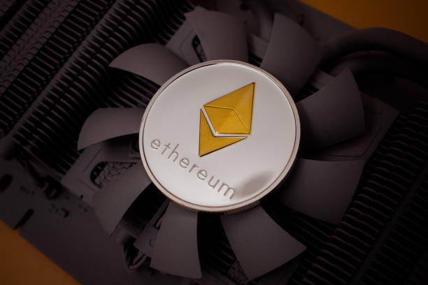Ethereum coin One silver ethereum coin over graphic videocard With Ethereum stock pictures, royalty-free photos & images