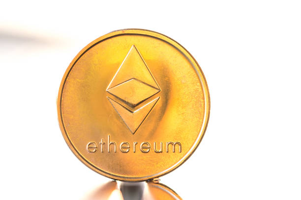 Ethereum gold color coin with sunset white background. Cryptocurrency virtual coin. Ethereum gold color coin with sunset white background. Cryptocurrency virtual coin  With Ethereum  stock pictures, royalty-free photos & images