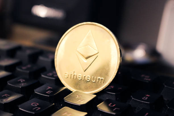 Ethereum on keyboard background. Closeup and front view Minsk, Belarus - May 24, 2019: Ethereum on keyboard background. Closeup and front view  With Ethereum  stock pictures, royalty-free photos & images