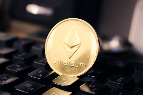 Ethereum on keyboard background. Closeup and front view Minsk, Belarus - May 24, 2019: Ethereum on keyboard background. Closeup and front view With Ethereum stock pictures, royalty-free photos & images