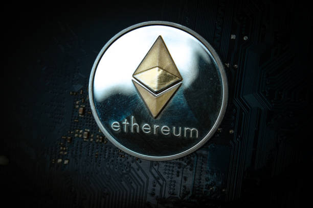 Ethereum Closeup shot of one ethereum coin over motherboard With Ethereum stock pictures, royalty-free photos & images