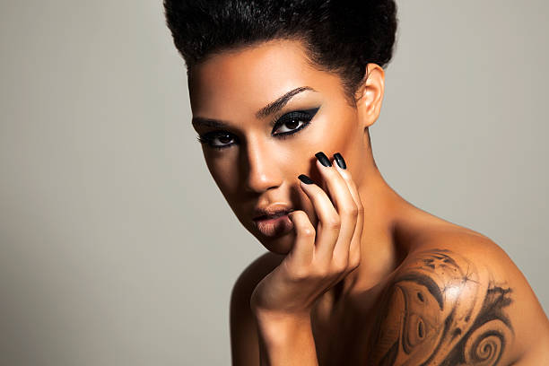 Ethnic beauty Beautiful black woman with a smokey eye and a winged eye liner and beautiful manicured black nails high fashion model stock pictures, royalty-free photos & images