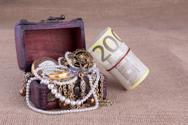 200 Euro Money Roll and Jewelry Chest 200 Euro Money Roll and Jewelry Chest jewelry treasure chest gold crate stock pictures, royalty-free photos & images