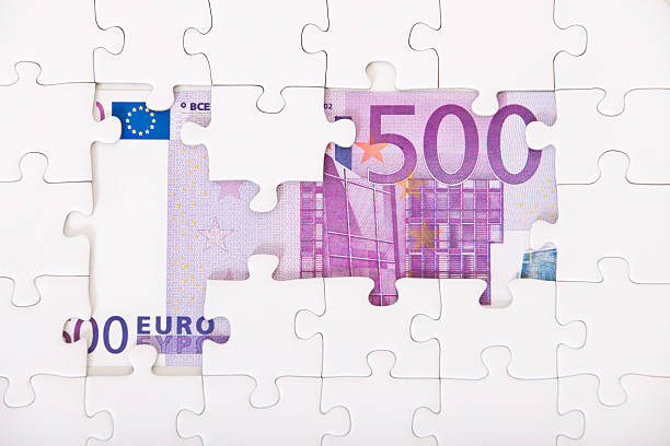 500 euro note behind puzzle stock photo