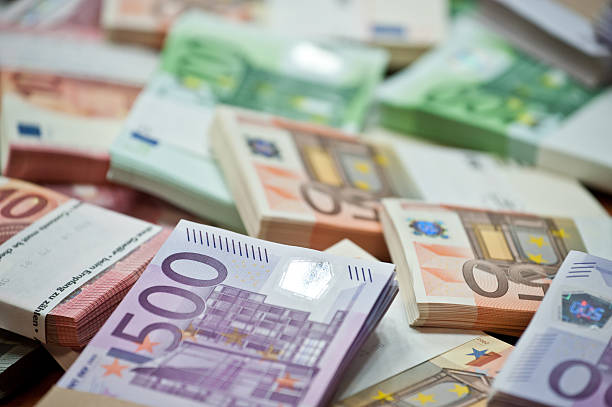 euro lots of euro bills on the table European Union stock pictures, royalty-free photos & images