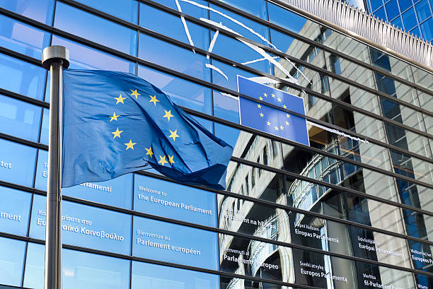 European Union flag against European Parliament stock photo