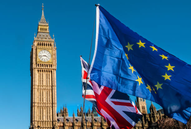 European Union flag in front of Big Ben, Brexit EU European Union and UK flags in front of Big Ben, Brexit EU brexit stock pictures, royalty-free photos & images