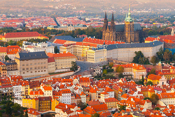Evening aerial view of Prague Castle complex in Czech Republic Prague Castle complex with gothic St Vitus Cathedral in the evening time illuminated by sunset, Hradcany, Prague, Czech Republic. UNESCO World Heritage. Aerial shot from Petrin Tower. hradcany castle stock pictures, royalty-free photos & images
