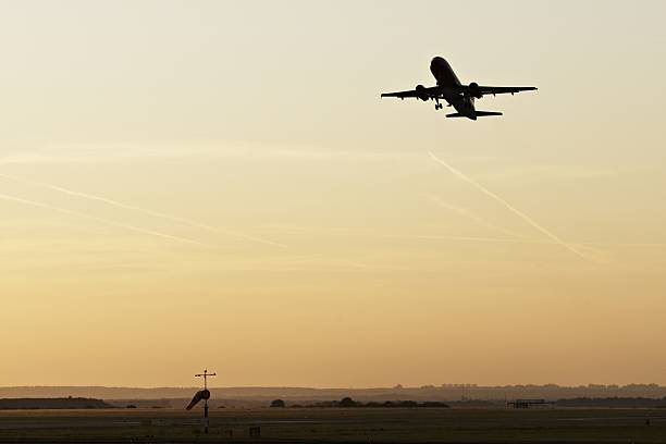 Silhouette of the airplane - evening on the Prague Airport