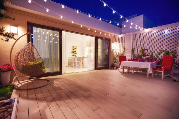 evening patio area with open space kitchen and sliding doors evening patio area with open space kitchen and sliding doors deck photos stock pictures, royalty-free photos & images
