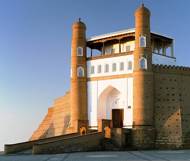 evening view of fortres Ark - Ark entrance evening view of fortres Ark - Ark entrance - City of Bukhara - Uzbekistan bukhara stock pictures, royalty-free photos & images