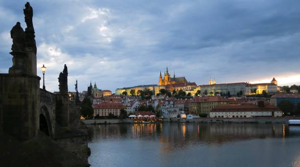 evening view of Prague Castle with the Vltava River from Charles Bridge in Prague Czech Republic stock photo