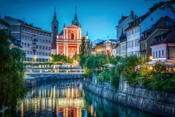 Evening view of the bridge and Ljubljanica river in the city center. Ljubljana, capital of Slovenia. stock photo