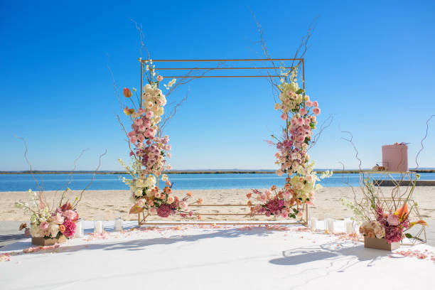Event decoration. Wedding chuppa at riverside decorated with fresh flowers. Florist workflow. Event decoration. Wedding chuppa at riverside decorated with fresh flowers. Florist workflow. chupah stock pictures, royalty-free photos & images