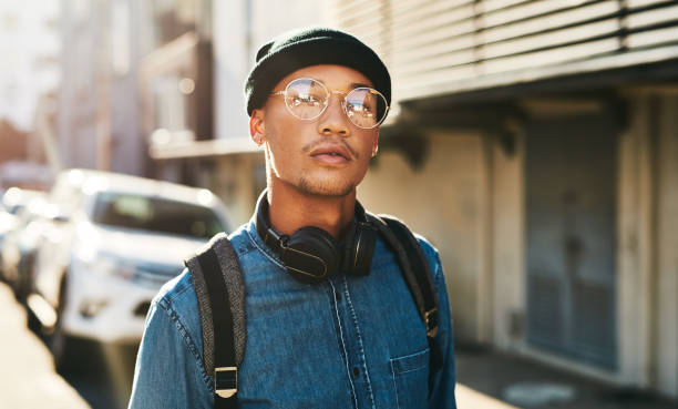 Every day is a new start Cropped shot of a handsome young man walking through the city hipster culture photos stock pictures, royalty-free photos & images