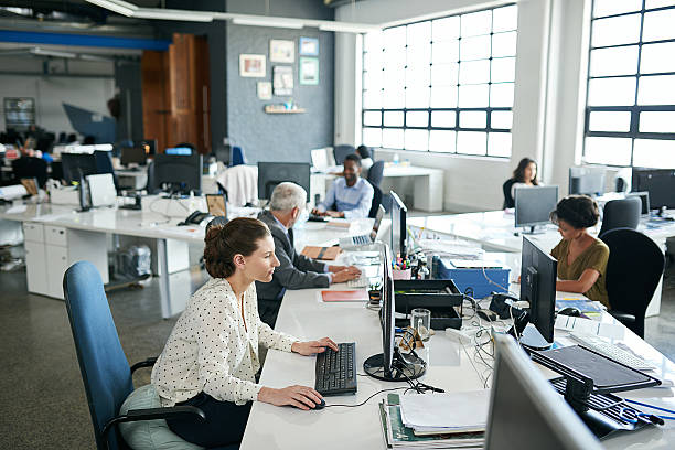 Everyone's one hundred percent focused in this office! stock photo