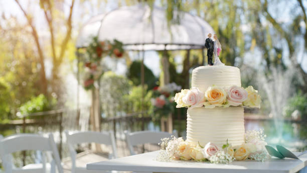 Still life shot of a wedding cake on a table outside