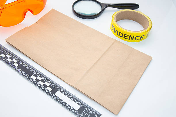 evidence bag with forensic tool stock photo