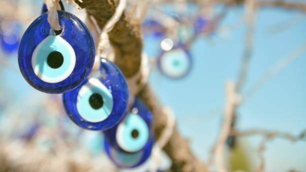 Evil Eye Amulets Hanging From The Tree stock photo