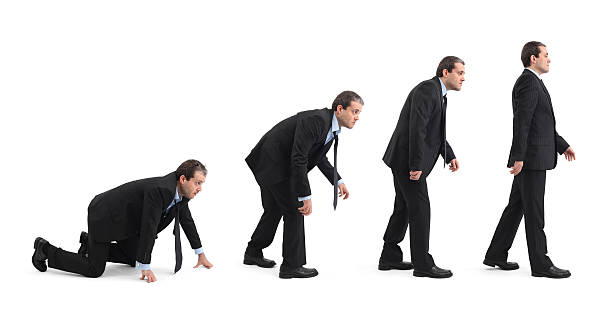 Evolution Of Businessman Improvement process of businessman after financial crisis. This image is modeled after well-known evolution theory figure. Same businessman is changing in four steps.Similar Image: crawling stock pictures, royalty-free photos & images