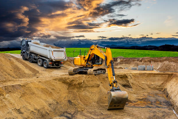 excavator at work on construction site stock photo