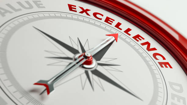 Excellence Concept: Arrow of A Compass Pointing Excellence Text Arrow of a compass is pointing excellence text on the compass. Arrow, excellence text and the frame of compass are red in color. Horizontal composition qith copy space. Quality and strategy concept. perfection stock pictures, royalty-free photos & images