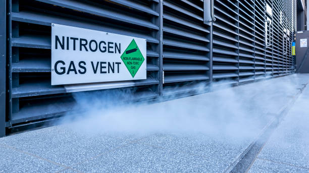 Excess white nitrogen gas fumes safely and harmlessly released to atmosphere stock photo