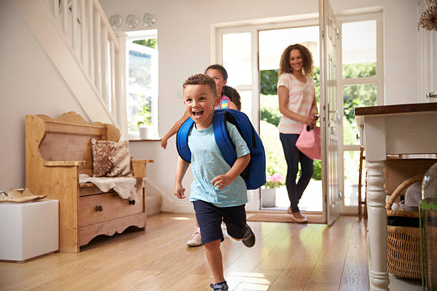 Excited Children Returning Home From School With Mother Excited Children Returning Home From School With Mother arrival stock pictures, royalty-free photos & images