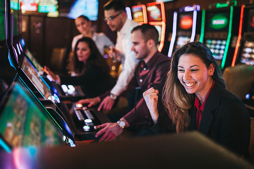 Excited woman winning in a casino