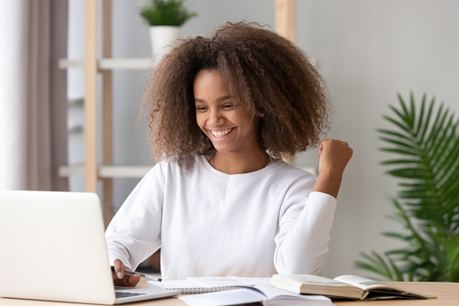 Picture of a student writing a scholarship essay on a laptop