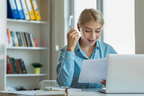 Excited woman reading mail letter with great news Excited woman reading mail letter with great news scholarships for females stock pictures, royalty-free photos & images