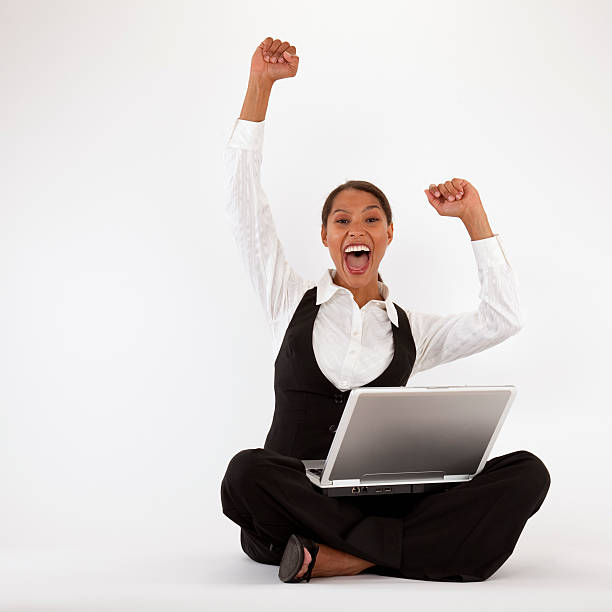 Excited Young Woman With Laptop stock photo