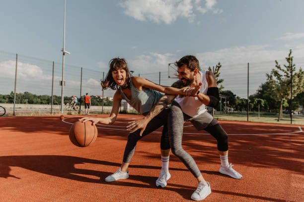 Excitement grows when you’re more playful on a basketball ground stock photo