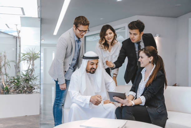 Executive Business team having conversation with a Arab Businessman stock photo