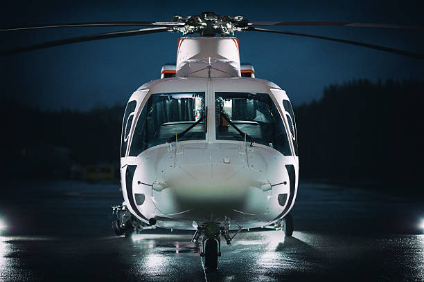 Executive Helicopter An executive helicopter with dramatic lighting. helicopter stock pictures, royalty-free photos & images