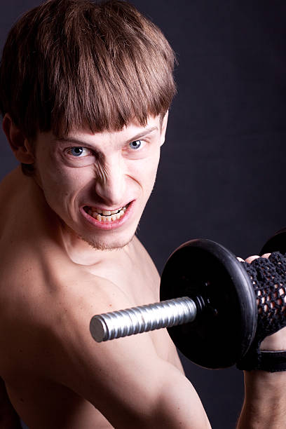 Exercises with dumbbell stock photo