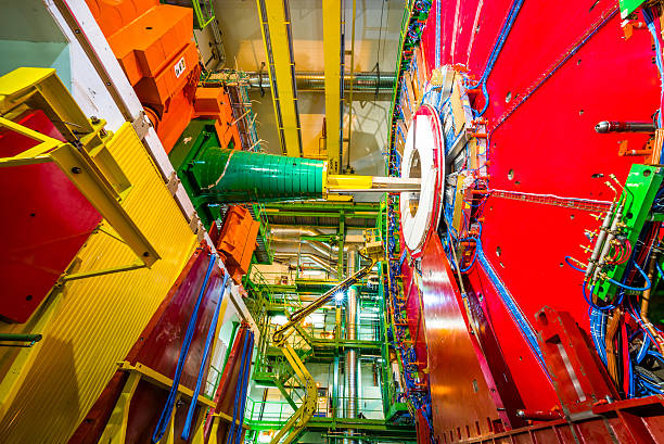 CMS Experiment Detector The 14,000 tonnes CMS detector, housed in a cathedral-like cavern, is an astounding feat of engineering and a symbol of large-scale international collaboration. large hadron collider stock pictures, royalty-free photos & images