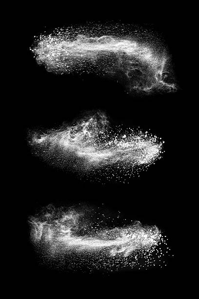 Abstract exploding white powder isolated on black background.