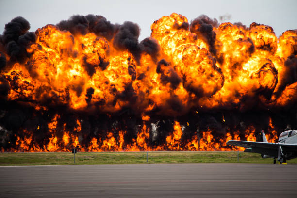 Explosion on an Air Field Explosion on an air strip at a air force base ww2 american fighter planes stock pictures, royalty-free photos & images