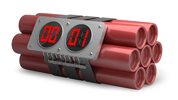 Explosives with alarm clock detonator stock photo